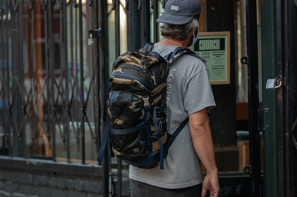 Porter COUNTERSHADE Backpack (woodland khaki) - Cotton Sheep About Counter Shade Series Developed in 1981, the COUNTER SHADE series features a Porter original camouflage pattern inspired by coniferous forests. The textile is unique for its color ways including light khaki green, dark forest green, navy, and charcoal. The name ‘counter shade’ represents the designer's use of shadows.