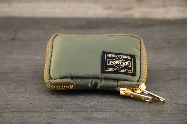 Porter Tanker Key Case About Porter Created in 1935 by Kichizo Yoshida, Porter Yoshida Kaban has been producing timeless and functional bags that are built to last. As Porter continues to grow as a global force, they remain devoted to all products being handmade in Japan by one craftsman from beginning to end. Their devotion to quality and ‘spirit into every stitch’ is why Porter is an iconic Japanese staple amongst businessmen, adventurers, and fashion lovers. 
