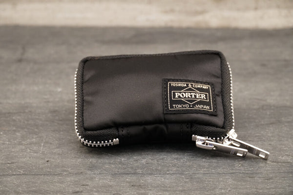  Porter Tanker Key Case About Porter Created in 1935 by Kichizo Yoshida, Porter Yoshida Kaban has been producing timeless and functional bags that are built to last. As Porter continues to grow as a global force, they remain devoted to all products being handmade in Japan by one craftsman from beginning to end. Their devotion to quality and ‘spirit into every stitch’ is why Porter is an iconic Japanese staple amongst businessmen, adventurers, and fashion lovers.