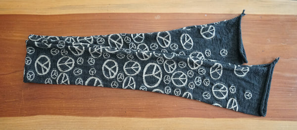 Kapital Peace Mark Scarf, Black, Cream A simple scarf with an all-over peace symbol print ☮︎ 74 in x 17.7 in 100% Wool Made in Japan Additional info About Kapital In 1985 Toshikiyo Hirata started a denim factory in Kojima, Okayama the denim capital of Japan. In 2002, Toshikiyo’s son Kiro Hirata joined his father’s denim factory and revolutionized the business into the iconic fashion brand that Kapital is today. Kapital is inspired by Americana, traditional Japan, and the