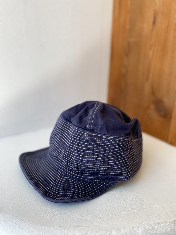 Kapital Chino Old Man and the Sea Cap Kapital chino style cap hat with stitching all along the brim A simple, yet stylish everyday cap with decorative stitching all along the brim. Available in three different neutral colors, this chino-style hat is a wardrobe staple.