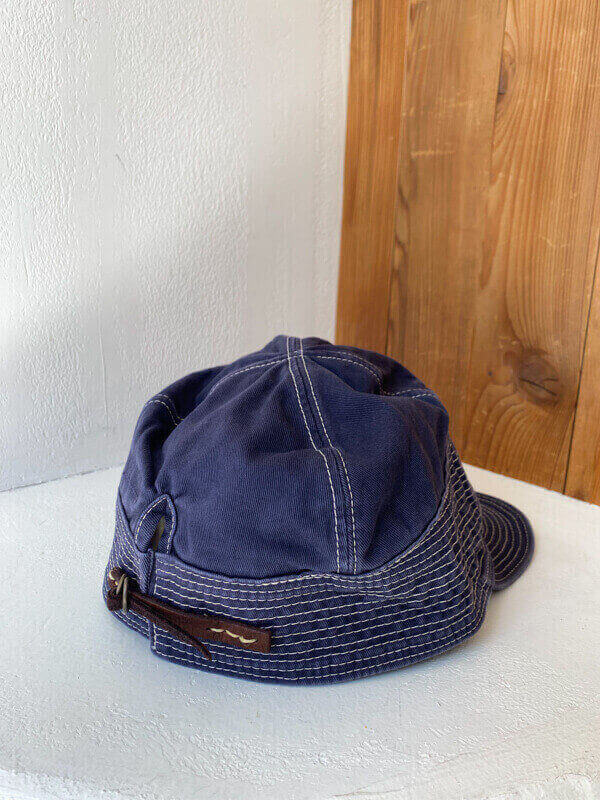 Kapital Chino Old Man and the Sea Cap Kapital chino style cap hat with stitching all along the brim A simple, yet stylish everyday cap with decorative stitching all along the brim. Available in three different neutral colors, this chino-style hat is a wardrobe staple.
